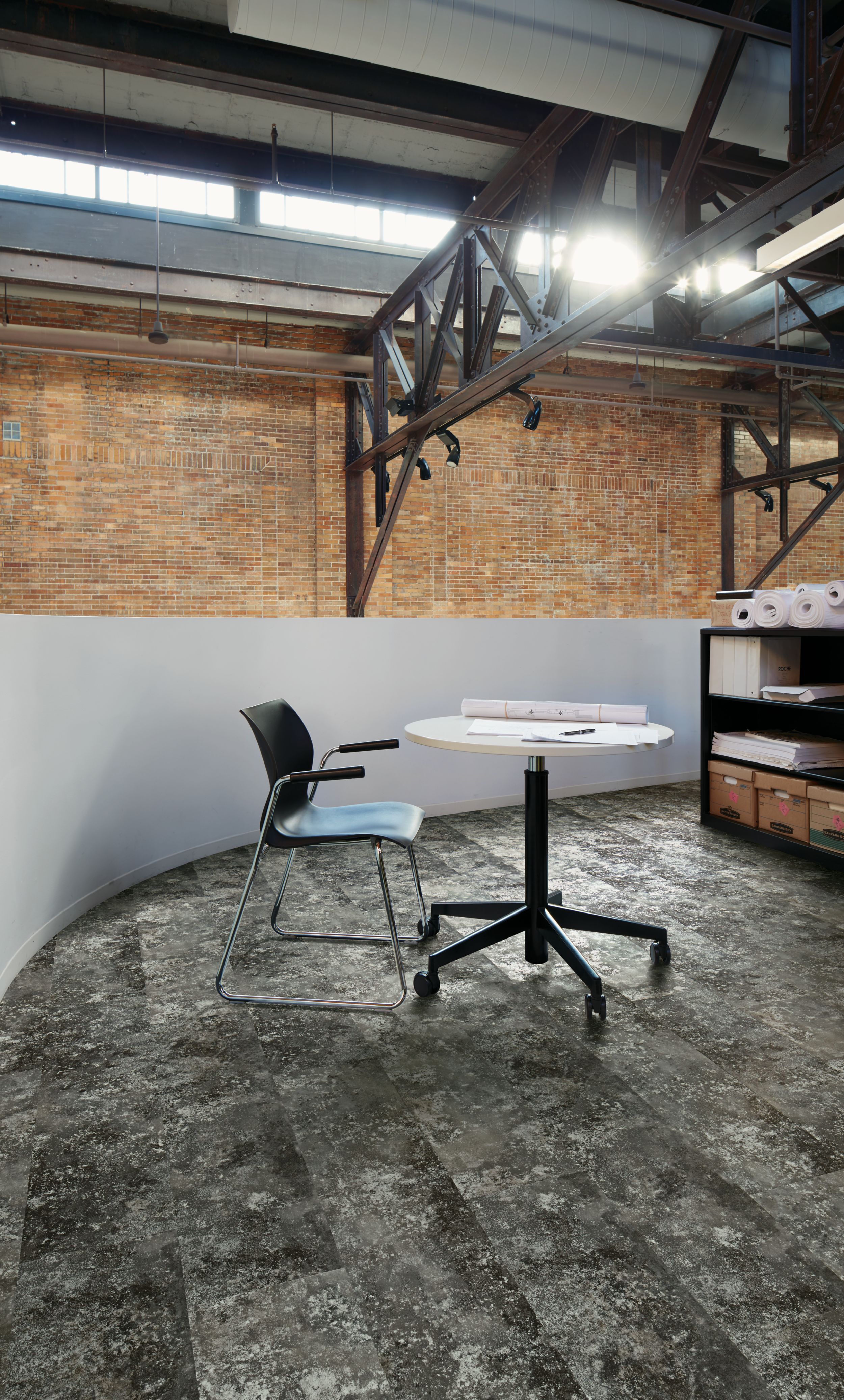 Interface Boundary Metallics LVT in industrial themed workspace with small table and chair image number 1